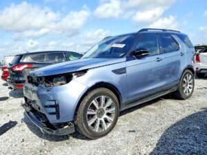 2019 Land Rover Discovery SUV with severe front-end collision damage in Tampa assessed for total loss appraisal.