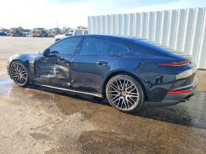 Porsche Panamera luxury sedan with driver side door and quarter panel collision damage assessed for total loss appraisal in Tampa