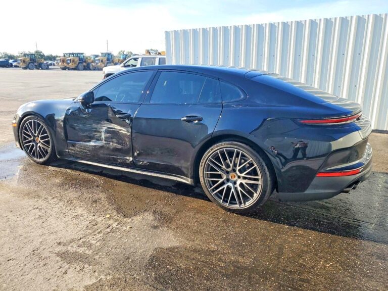 Porsche Panamera luxury sedan with driver side door and quarter panel collision damage assessed for total loss appraisal in Tampa
