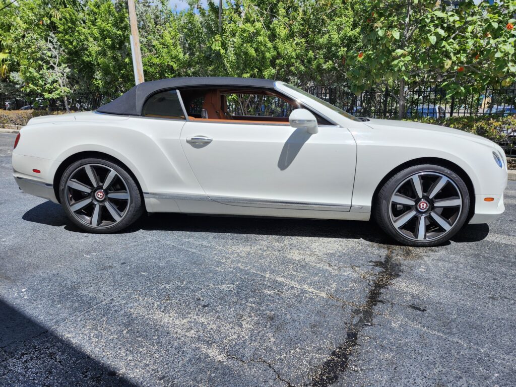 Bentley Continental GTC convertible with tan interior and black wheels photographed in West Palm Beach for total loss appraisal