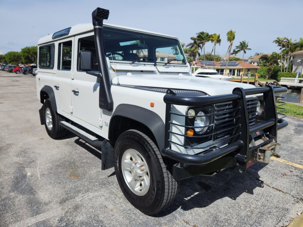 Land Rover Defender 110 TDi with snorkel and brush guard photographed in Tampa for total loss appraisal