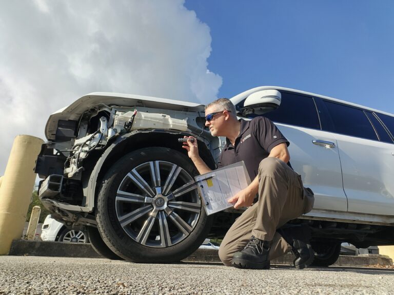Auto Praise certified vehicle appraiser inspecting totaled 2017 Lexus LX 570 — independent auto appraisal Margate Florida