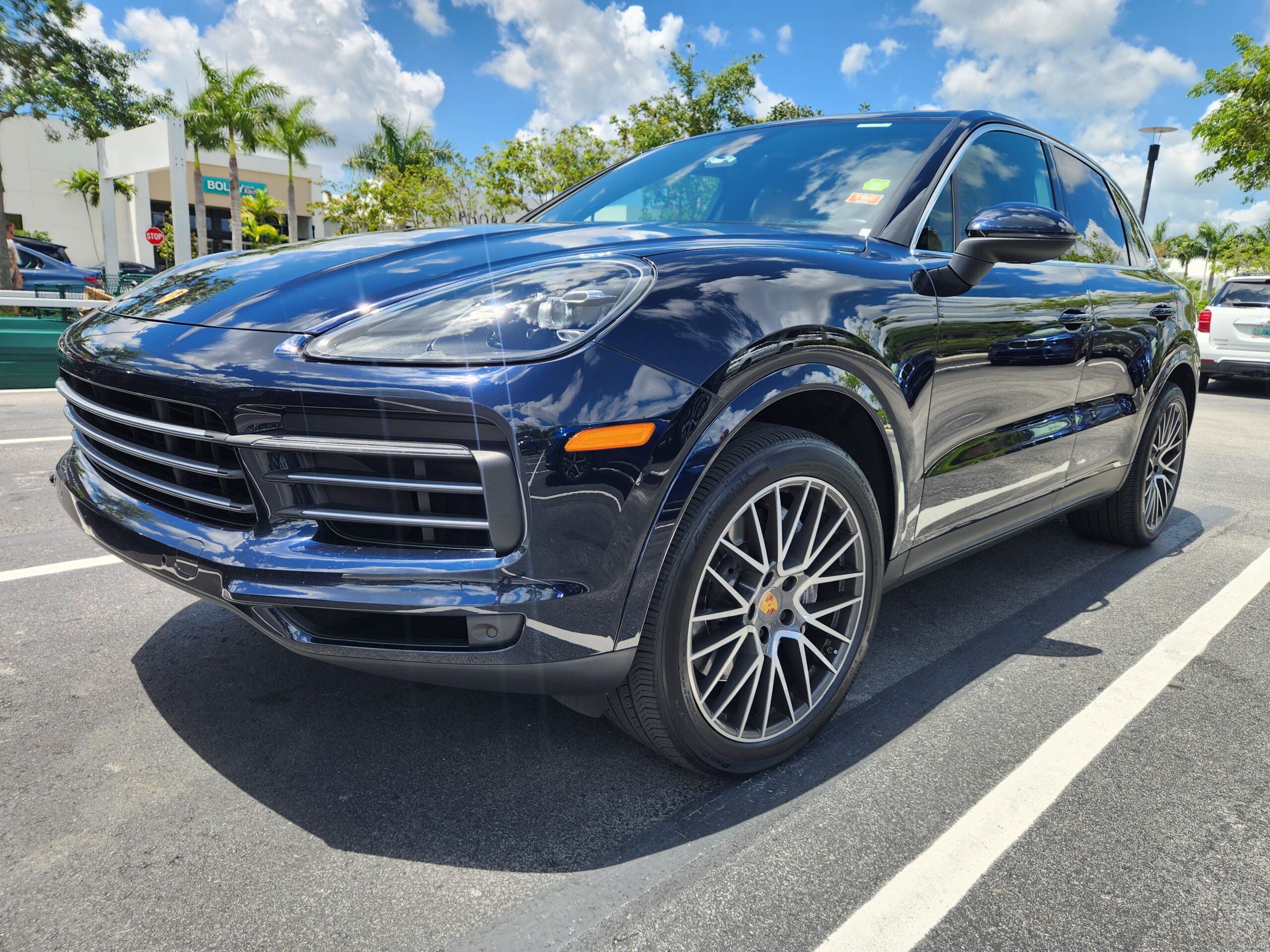 Porsche Cayenne luxury SUV front three-quarter view photographed in Boca Raton for total loss appraisal
