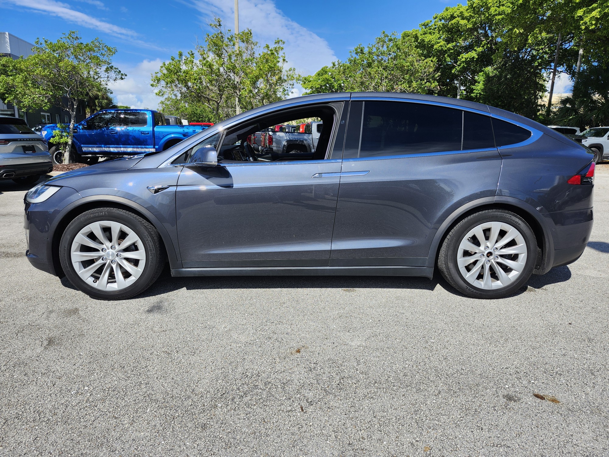 2017 Tesla Model X electric SUV side profile photographed in Coral Gables for total loss appraisal