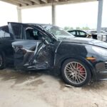 2013 Porsche Cayenne with severe driver side collision damage and shattered window in Jupiter assessed for total loss appraisal