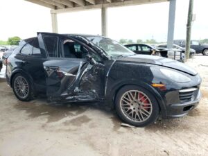 2013 Porsche Cayenne with severe driver side collision damage and shattered window in Jupiter assessed for total loss appraisal