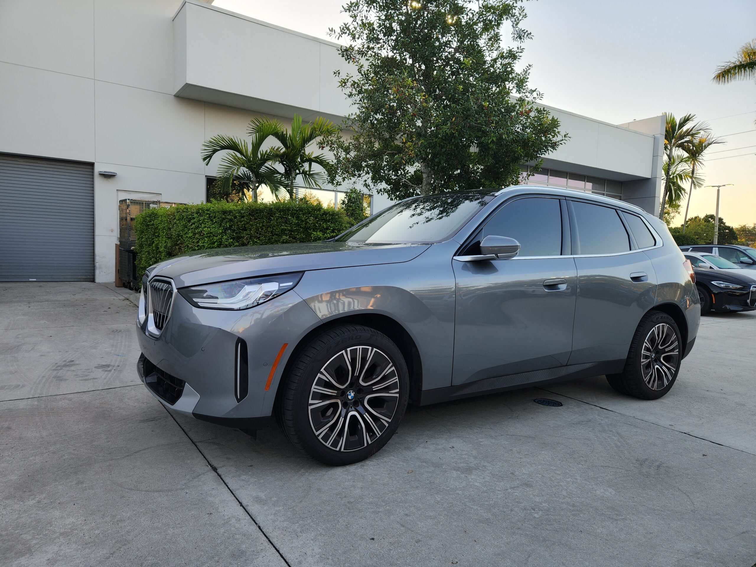 BMW X3 luxury SUV front three-quarter view photographed in Jupiter Florida for total loss appraisal