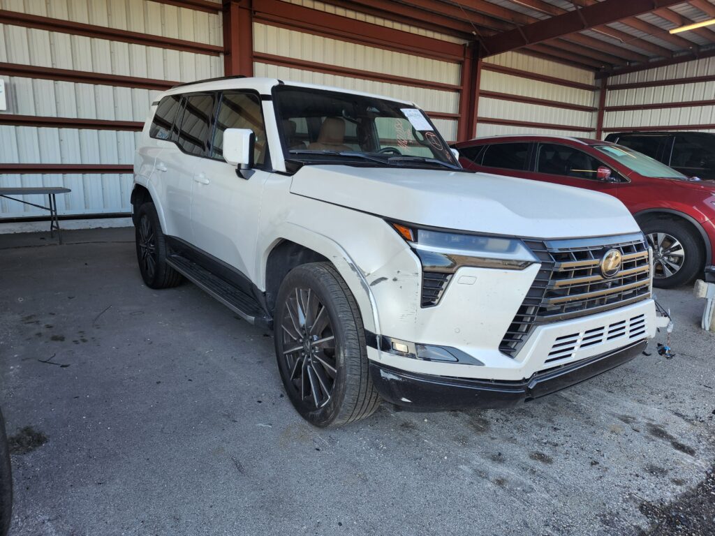 Lexus LX full-size luxury SUV with front passenger side collision damage photographed in Jupiter Florida for total loss appraisal