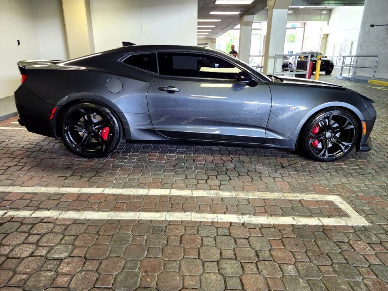 2018 Chevrolet Camaro SS with black wheels and red brake calipers side profile photographed in Pompano Beach for total loss appraisal