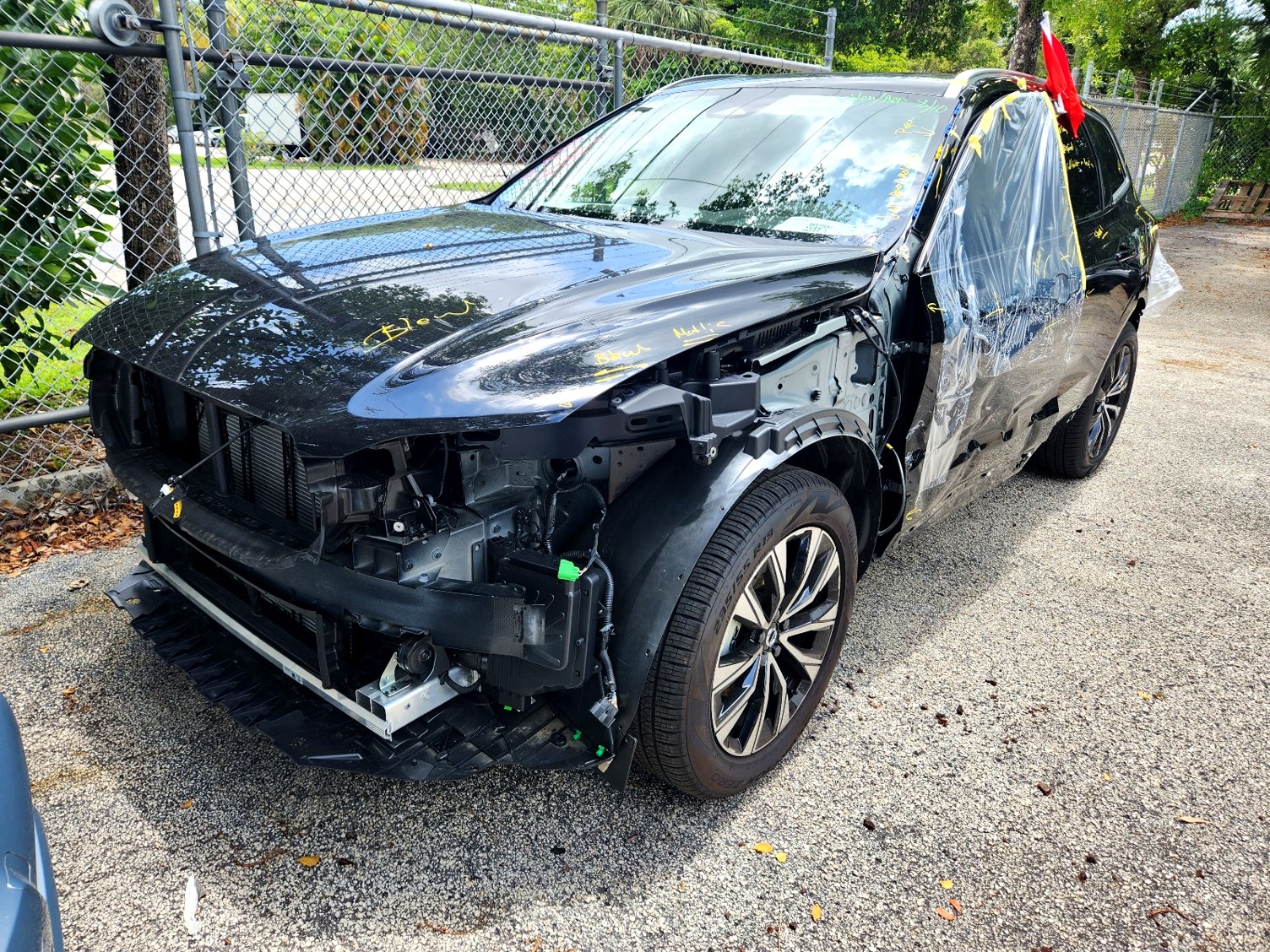 2025 Volvo XC90 with severe front-end and passenger side collision damage in Pompano Beach assessed for total loss appraisal